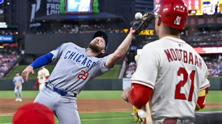 Can a first baseman stand in foul territory?